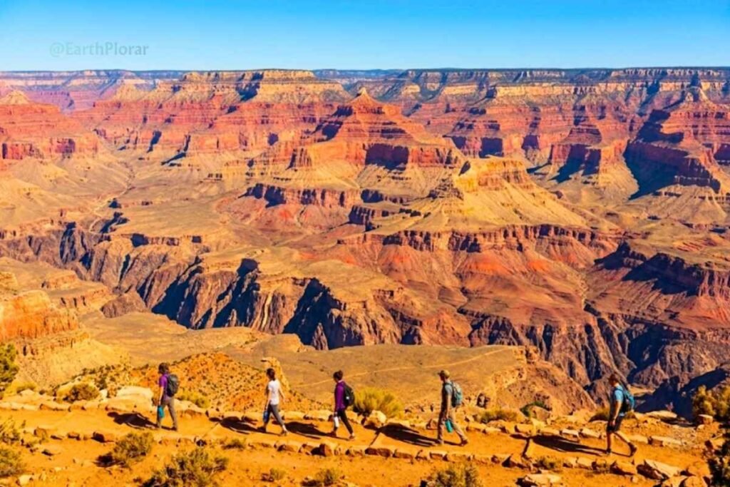 Hikers staying on marked trails at the Grand Canyon to protect the 7 natural wonders of the world.